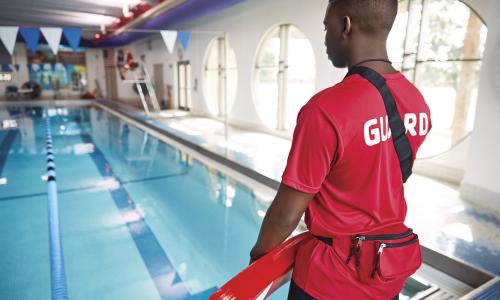 Back of a YMCA life guard on duty