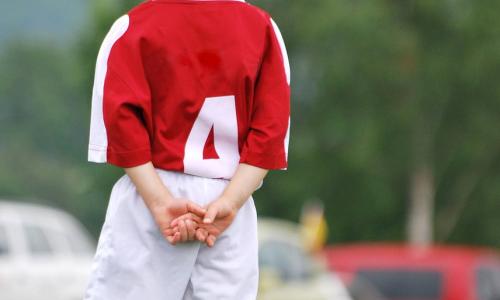 Young child in soccer uniform