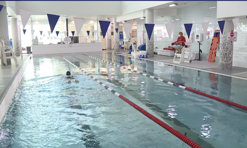 Member swimming at the Parker Hannifin Downtown YMCA pool