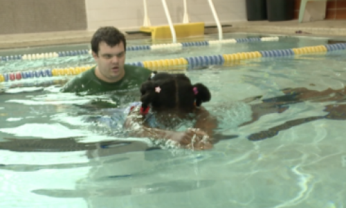 Swim instructor teaching swim lessons