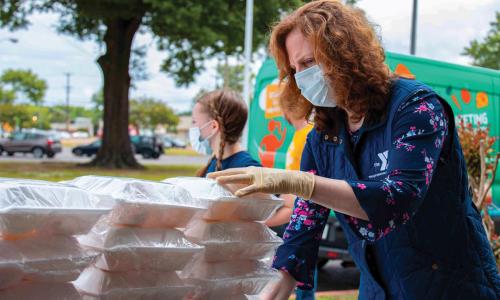 YMCA staff and volunteers preparing to hand out food to the community