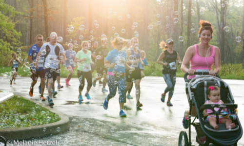 People running outside in the Bubble Run 5K