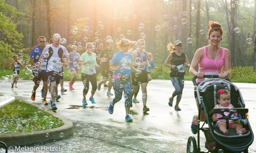 runners with bubbles