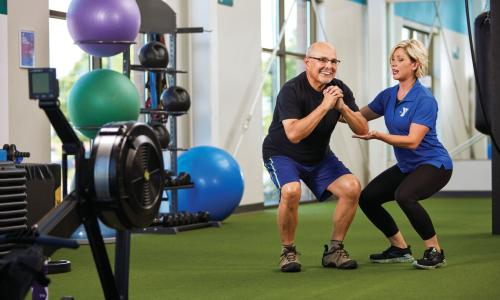 Man working out with a YMCA Personal Trainer