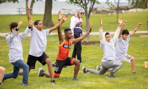 Triathletes warming up for Kids That Tri with the YMCA of Greater Cleveland
