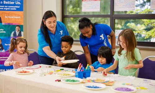 YMCA staff help campers