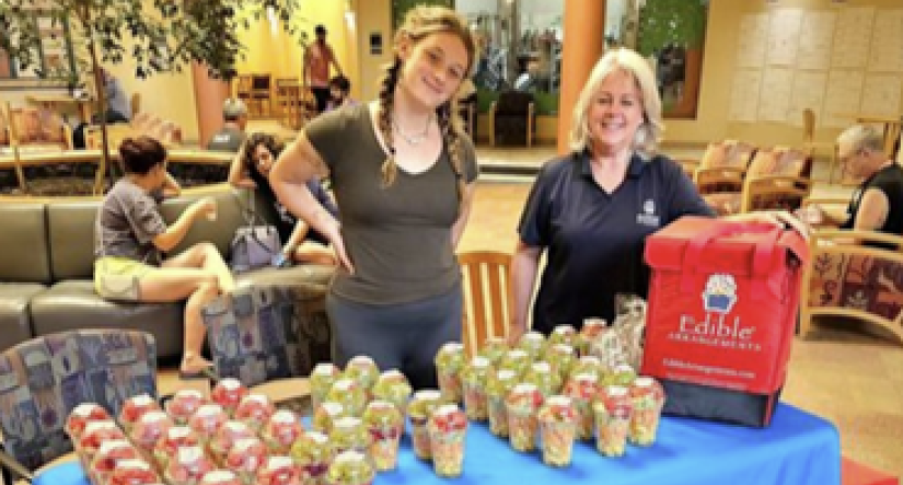 Geauga YMCA staff gives out fruit cups to the community in need