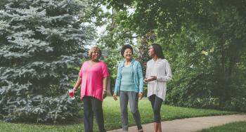 Three women walking outside